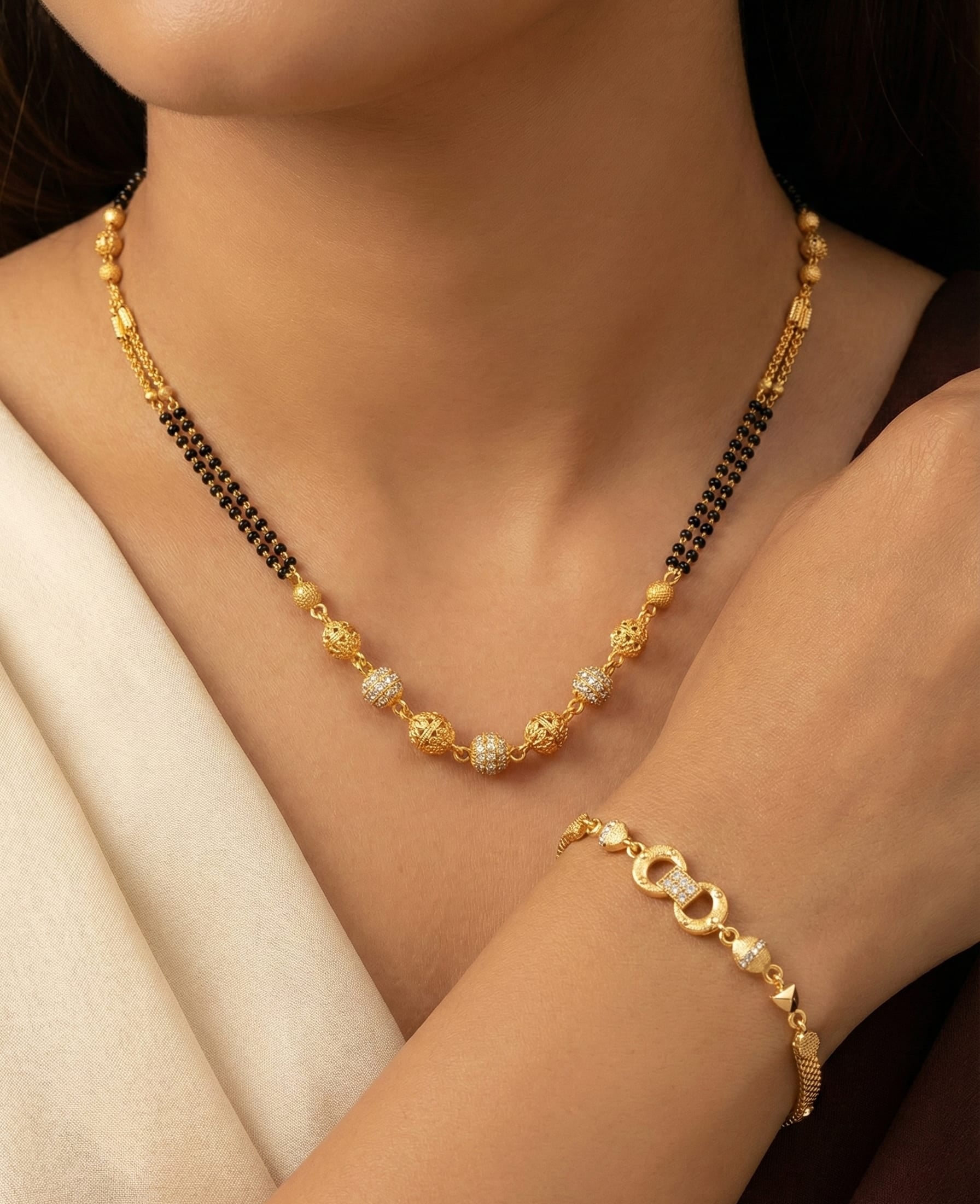 Elegant Dual Line Black Beaded Gold-Plated Mangalsutra with Designer Gold  Plated Bracelet