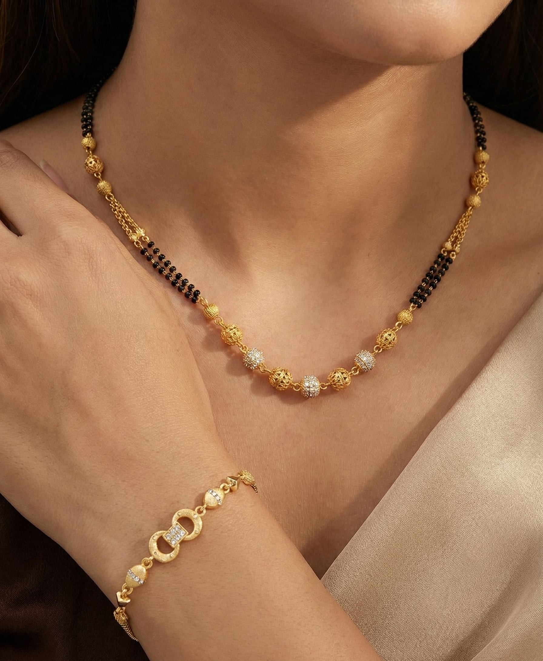 Elegant Dual Line Black Beaded Gold-Plated Mangalsutra with Designer Gold  Plated Bracelet