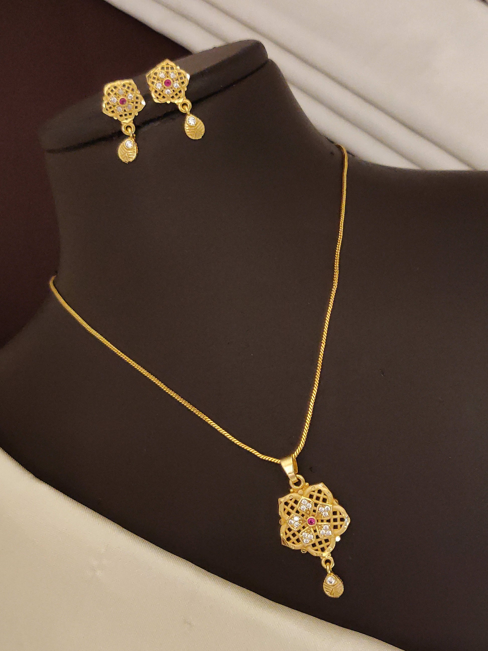 High Gold Plated And Diamond Studded Fancy Forming Pendant Set with Earrings