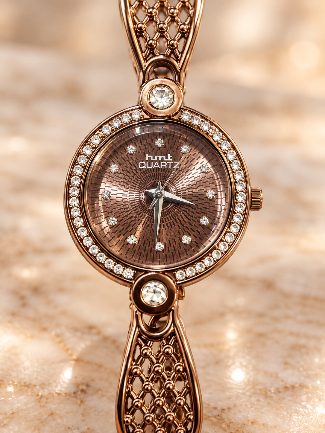 Elegant Brown Analog Dial Wristwatch with Textured Leaf Accents